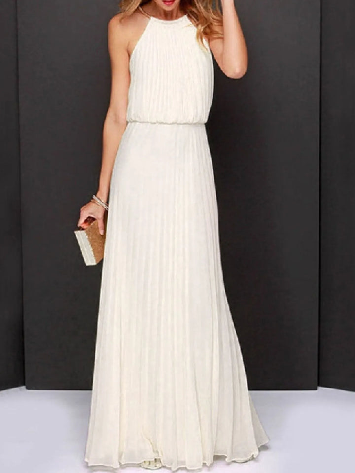 Woman wearing a long white dress against a black background