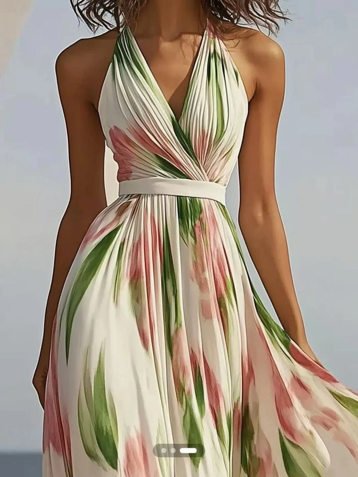 Woman wearing a floral maxi dress with a blurred background
