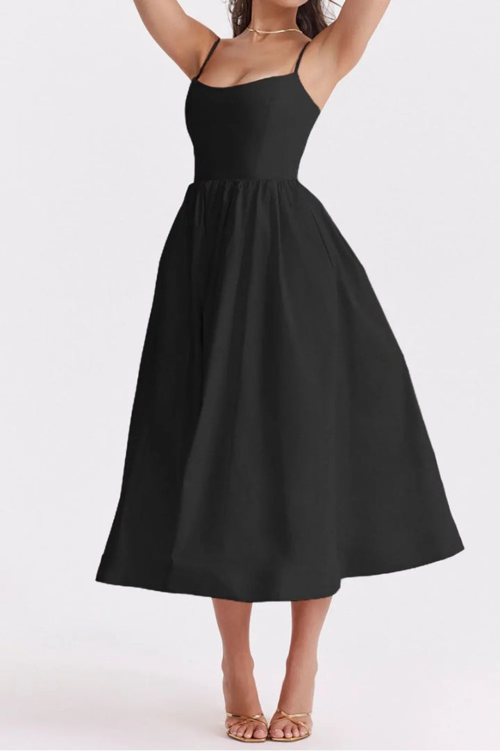 Black dress worn by a person on a white background