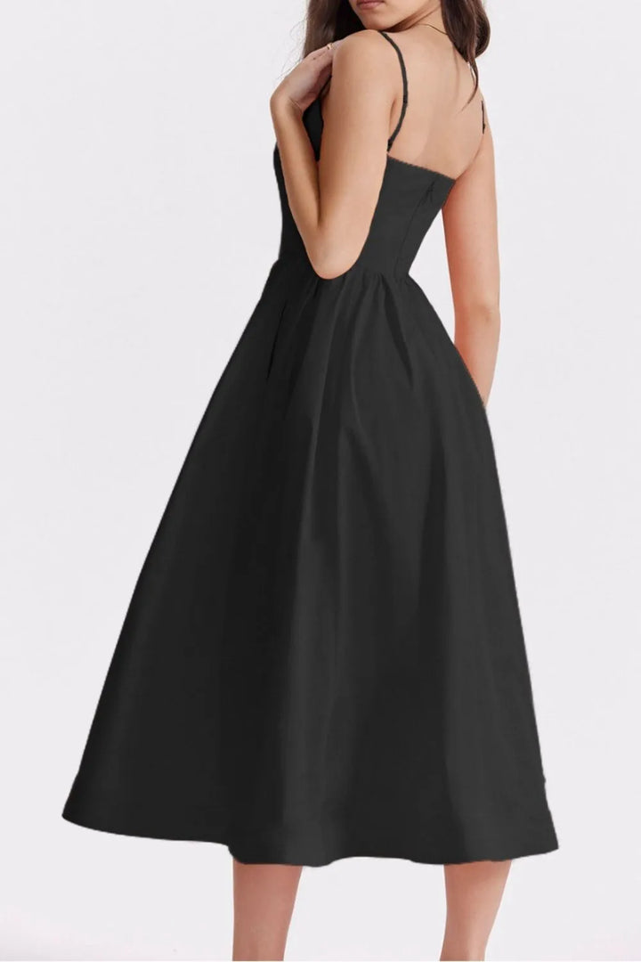 Black dress with thin straps on a white background