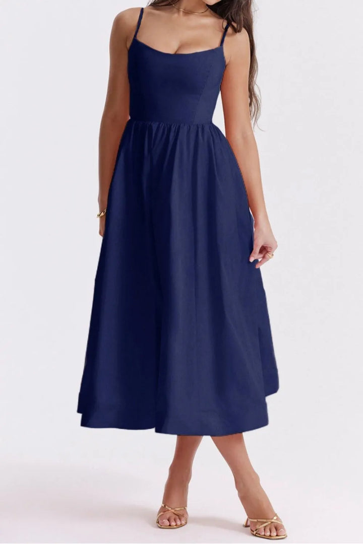 Navy blue dress worn by a model on a white background