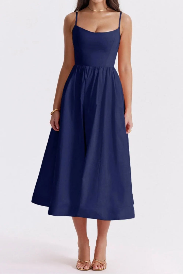 Navy blue dress worn by a model on a white background