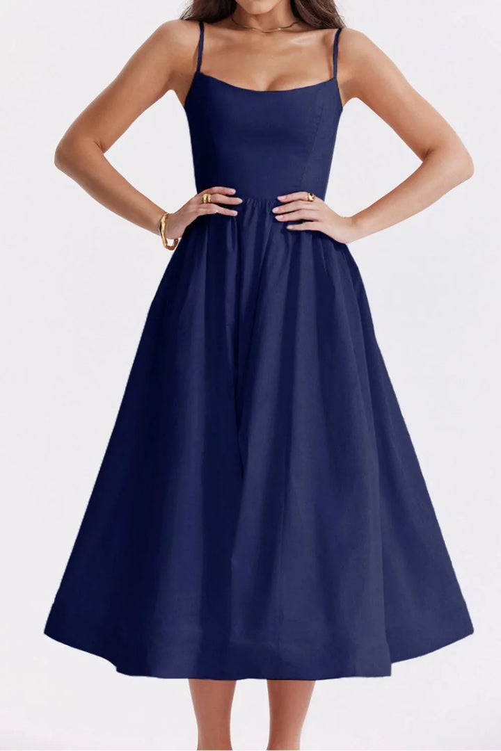 Navy blue dress worn by a model on a white background