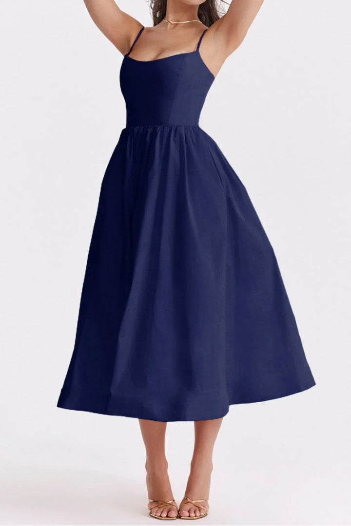 Navy blue dress worn by a model on a white background