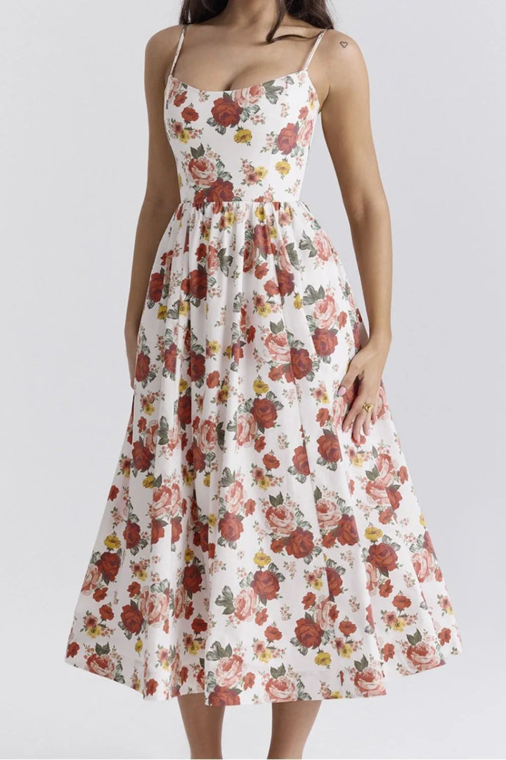 Floral dress with red and orange flowers on a white background