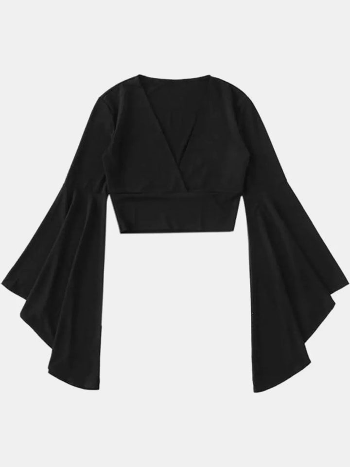 Black crop top with wide sleeves on a white background