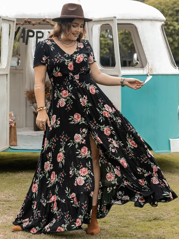 Woman in a plus sized floral maxi dress standing in front of a vintage van