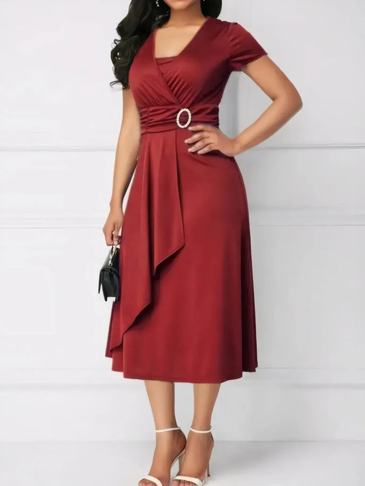 Red dress with a belt on a white background