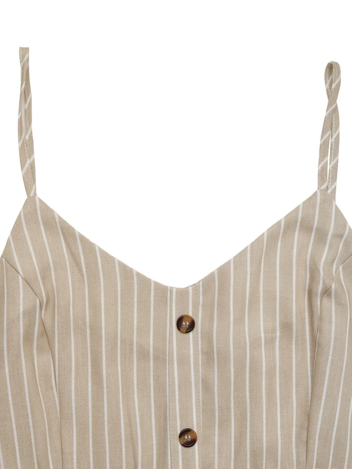 cami dress with button details closed up shot on a white background